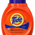 A bottle of tide detergent on top of a table.