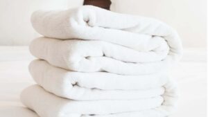 A stack of white towels on top of each other.